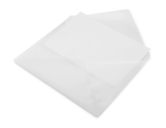 Photo of Blank greeting card in paper envelope on white background