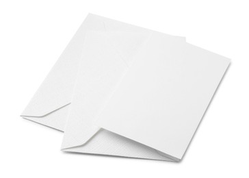 Photo of Blank greeting card and paper envelopes on white background