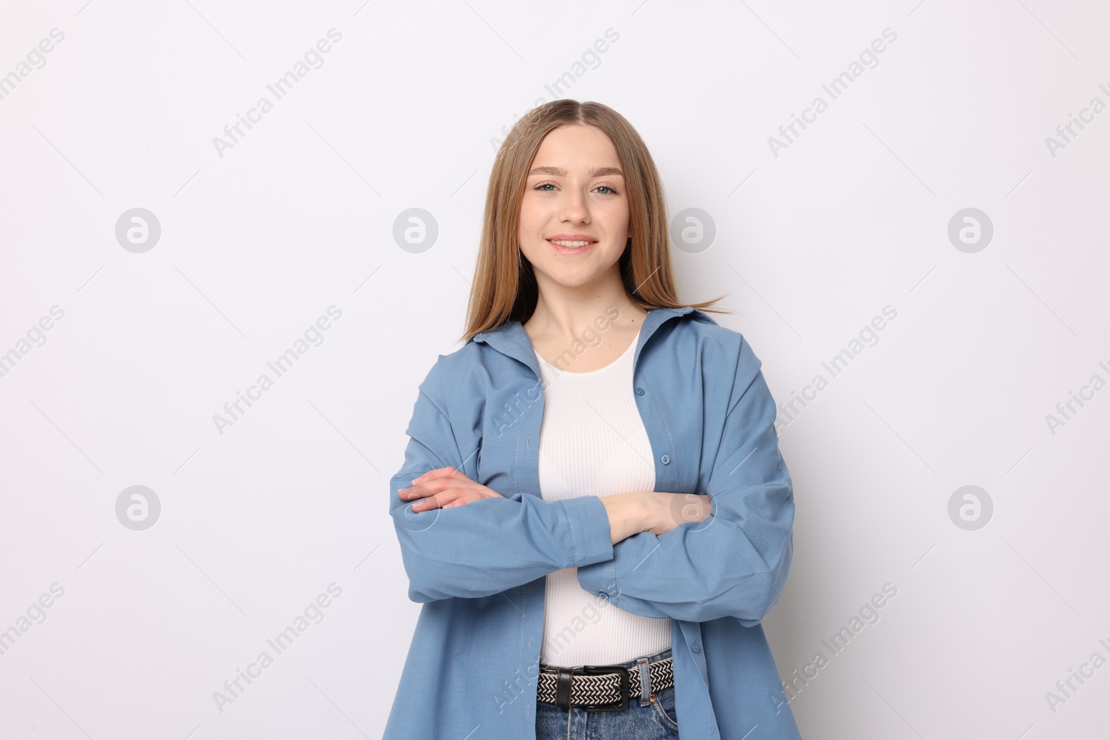 Portrait of smiling teenage girl on white background Photo of Portrait of smiling teenage girl on white background