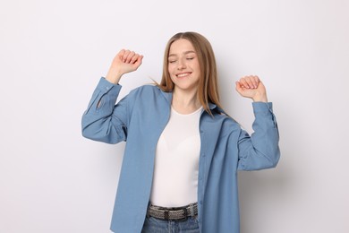 Photo of Portrait of smiling teenage girl on white background