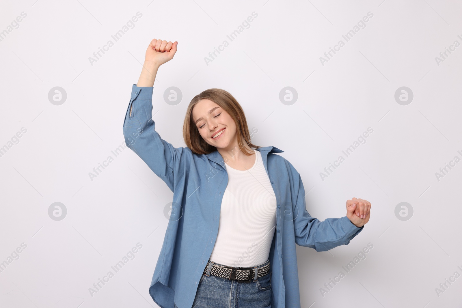 Portrait of smiling teenage girl on white background Photo of Portrait of smiling teenage girl on white background