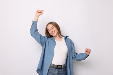 Photo of Portrait of smiling teenage girl on white background