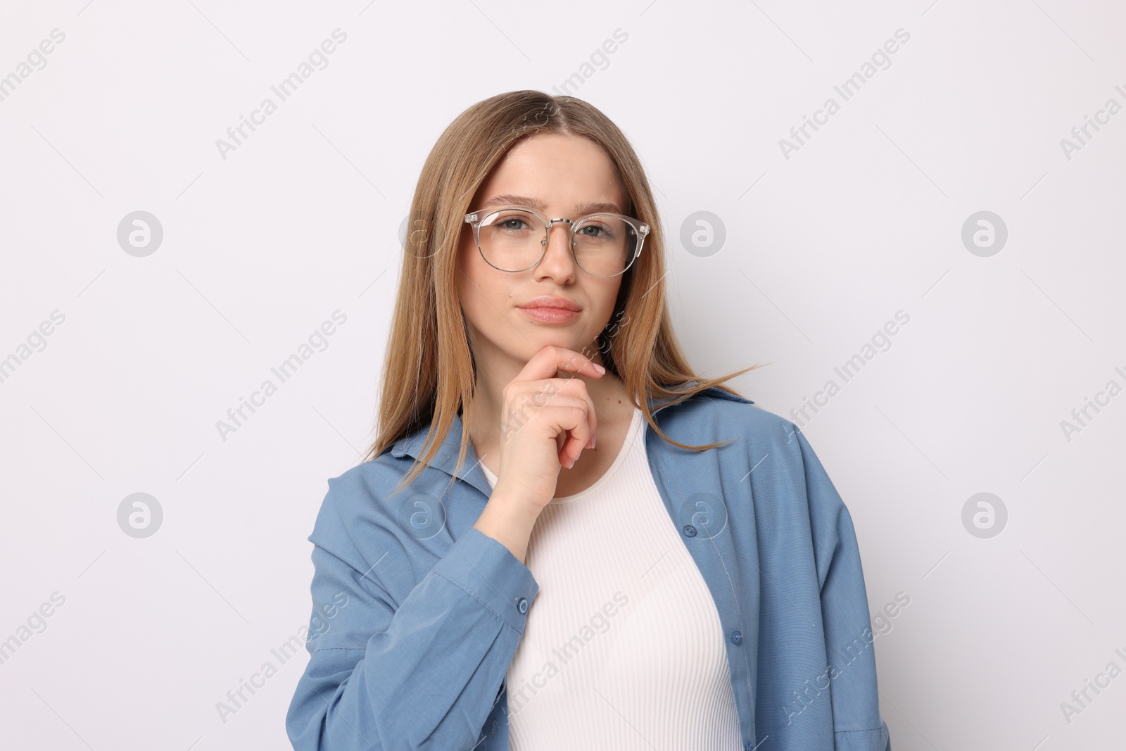 Portrait of thoughtful teenage girl on white background Photo of Portrait of thoughtful teenage girl on white background