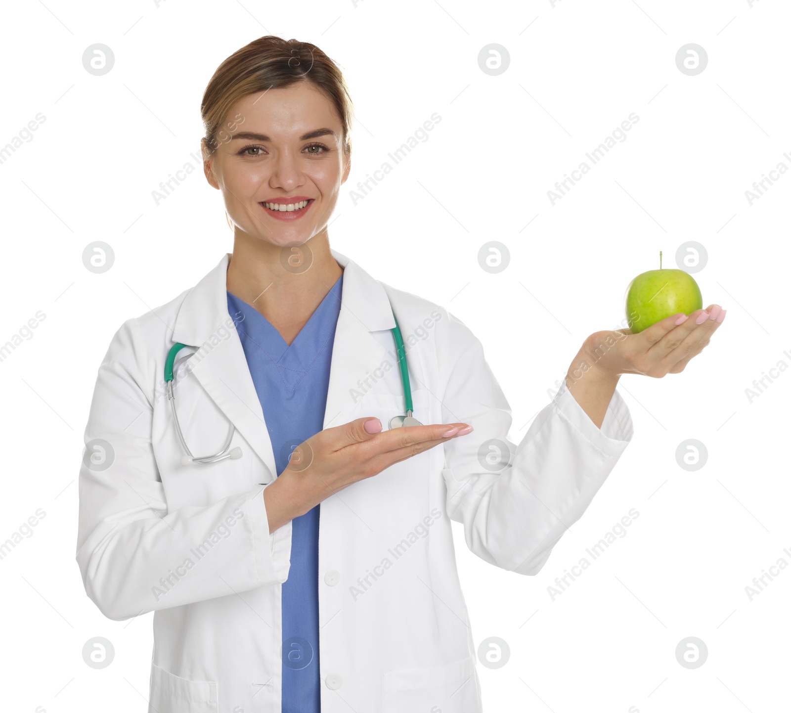Nutritionist with green apple and stethoscope on white background Photo of Nutritionist with green apple and stethoscope on white background