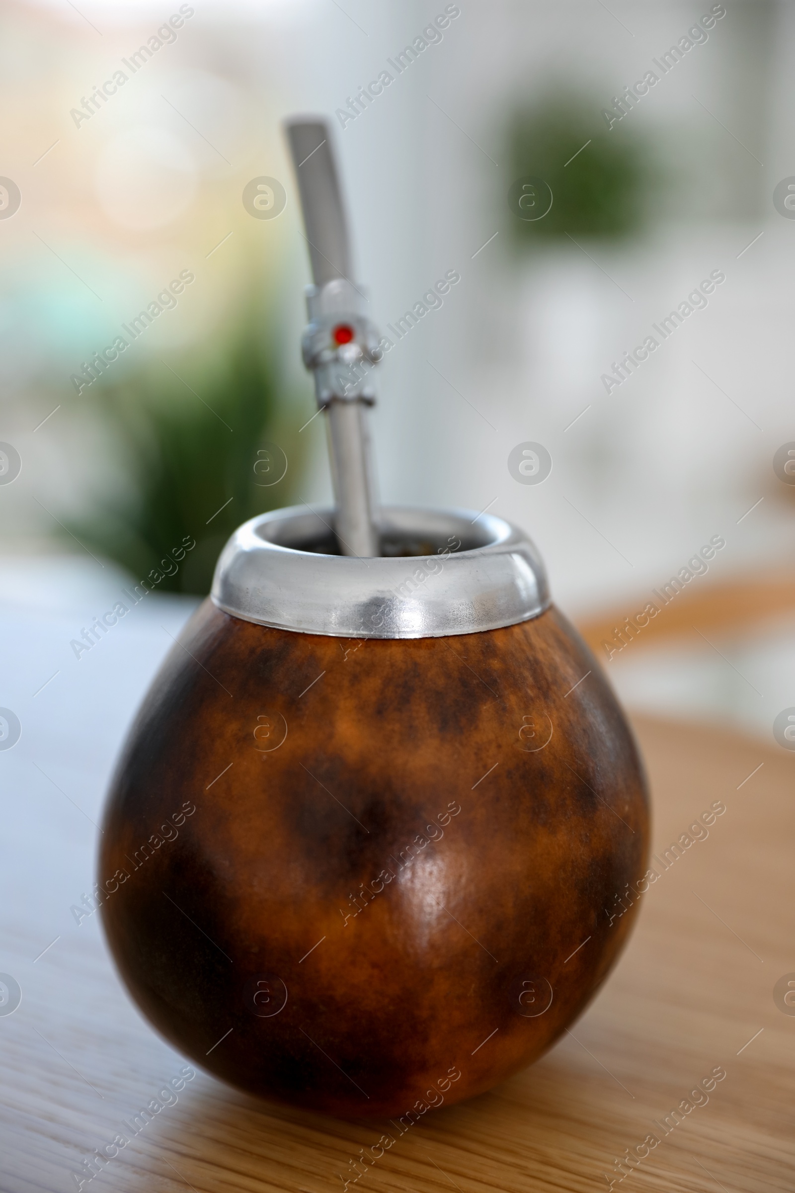 Traditional yerba mate tea on wooden table indoors, closeup Photo of Traditional yerba mate tea on wooden table indoors, closeup