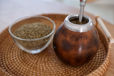 Photo of Traditional yerba mate tea on table, closeup