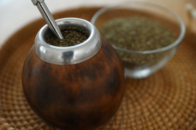 Photo of Traditional yerba mate tea on table, closeup
