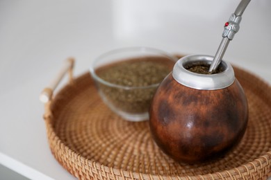 Photo of Traditional yerba mate tea on table, closeup
