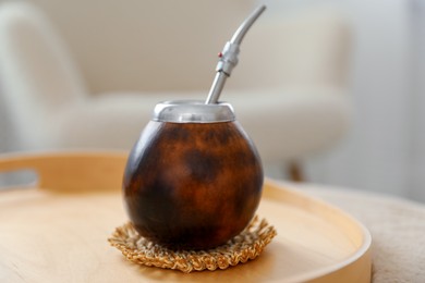 Photo of Traditional yerba mate tea on table indoors, closeup