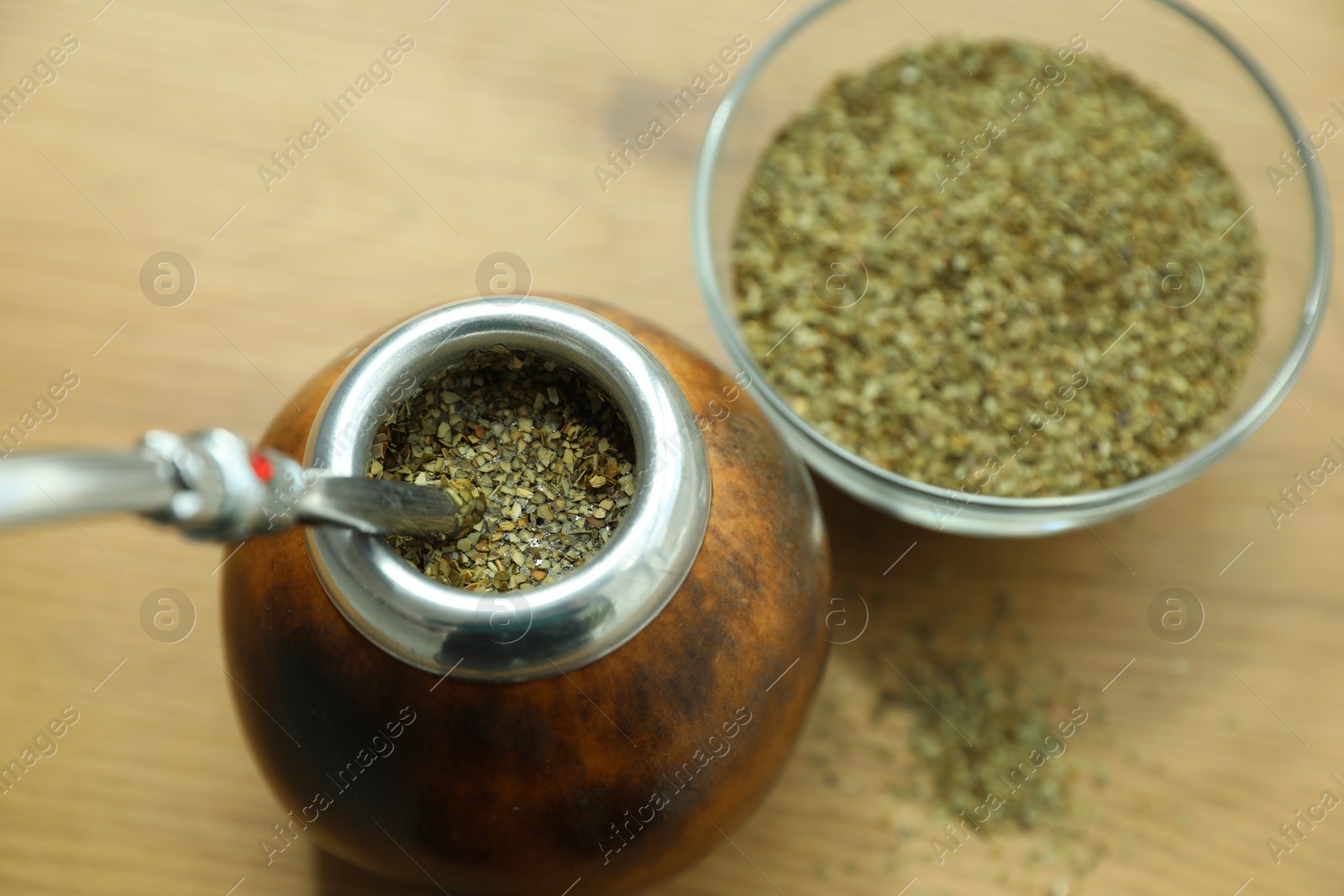 Traditional yerba mate tea on wooden table, above view Photo of Traditional yerba mate tea on wooden table, above view