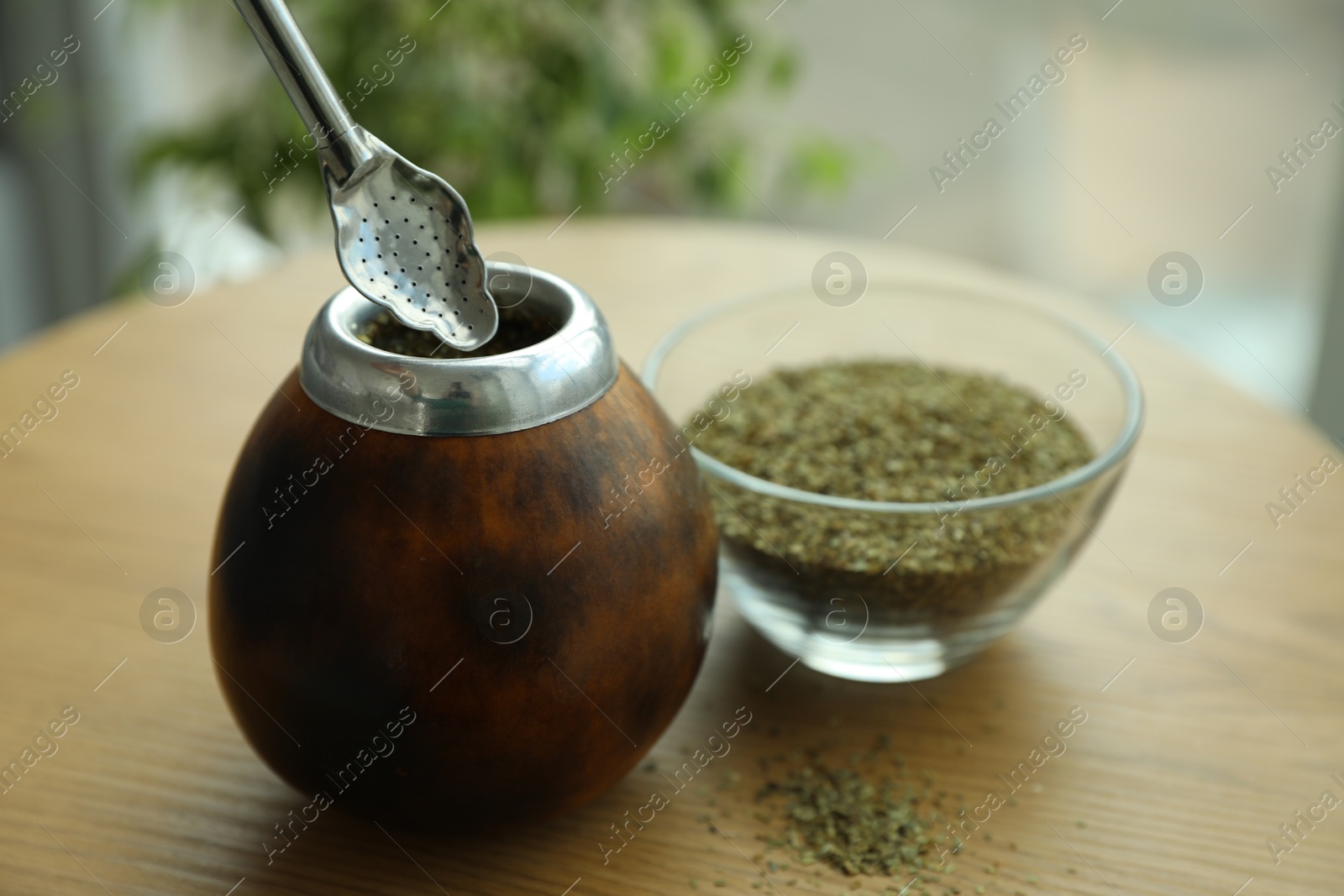 Traditional yerba mate tea on wooden table indoors, closeup Photo of Traditional yerba mate tea on wooden table indoors, closeup