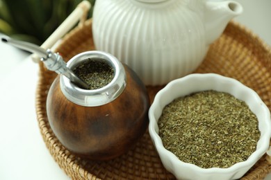 Photo of Traditional yerba mate tea on table, closeup