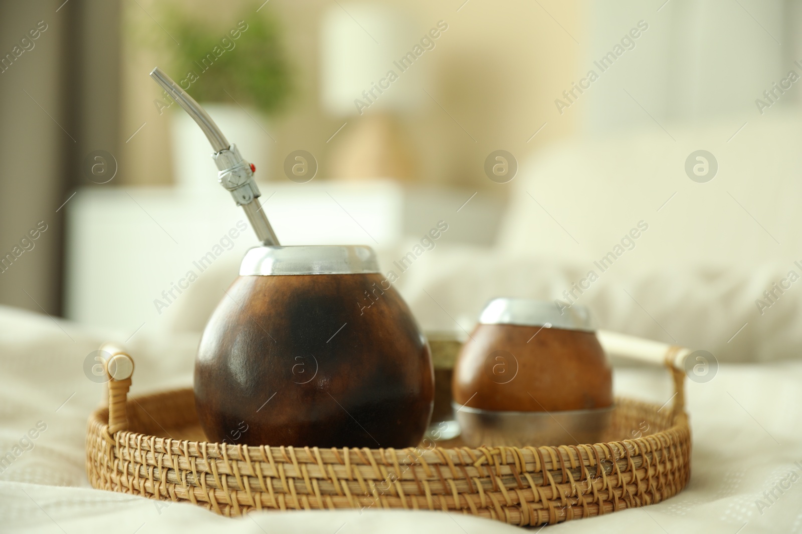 Traditional yerba mate tea on bed indoors, closeup Photo of Traditional yerba mate tea on bed indoors, closeup