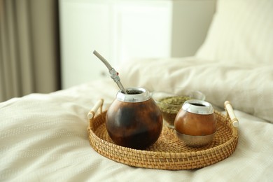 Photo of Traditional yerba mate tea on bed indoors
