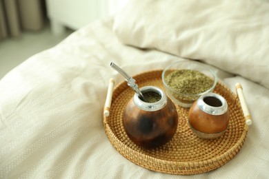 Photo of Traditional yerba mate tea on bed indoors