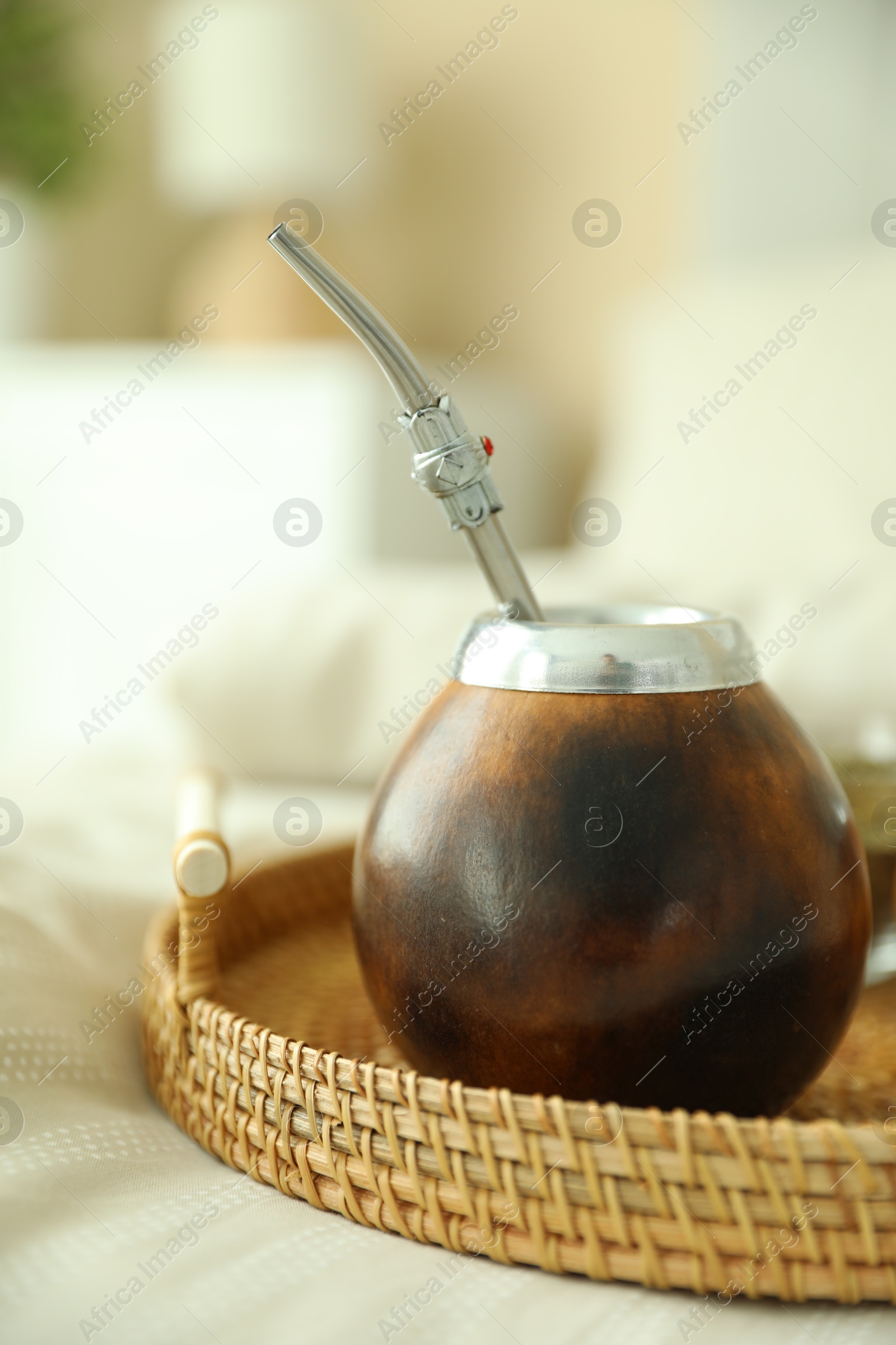 Traditional yerba mate tea on bed indoors, closeup Photo of Traditional yerba mate tea on bed indoors, closeup