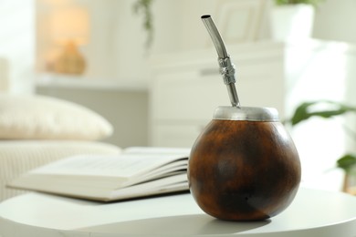 Photo of Traditional yerba mate tea on white table indoors