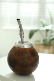 Photo of Traditional yerba mate tea on white table indoors