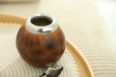 Photo of Traditional yerba mate tea on table, closeup