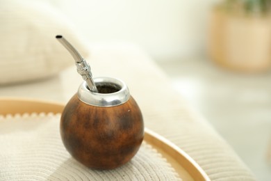 Photo of Traditional yerba mate tea on table indoors