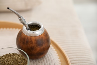 Photo of Traditional yerba mate tea on table, closeup