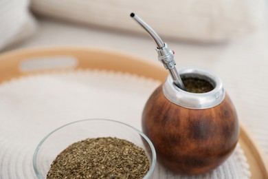Photo of Traditional yerba mate tea on table, closeup