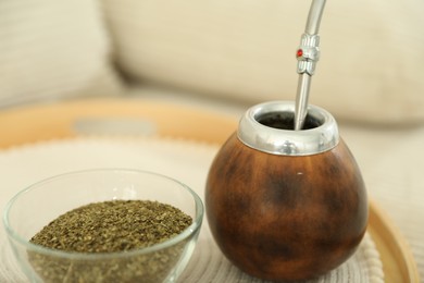 Photo of Traditional yerba mate tea on table, closeup