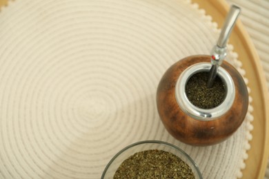 Photo of Traditional yerba mate tea on table, above view. Space for text