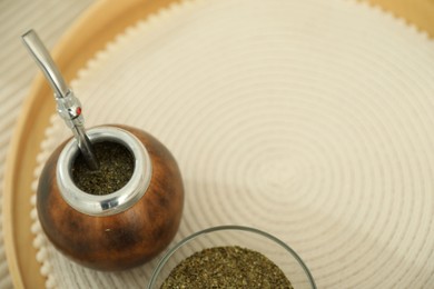Photo of Traditional yerba mate tea on table, above view. Space for text