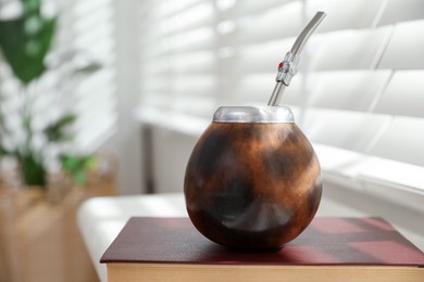 Photo of Traditional yerba mate tea on windowsill indoors