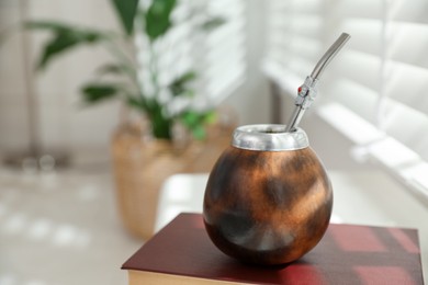 Photo of Traditional yerba mate tea on windowsill indoors