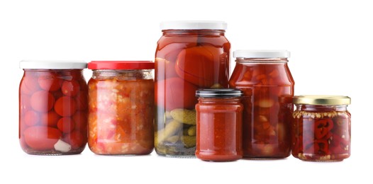 Photo of Many jars with different pickled products isolated on white