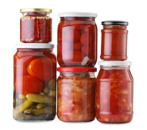 Photo of Many jars with different pickled products isolated on white