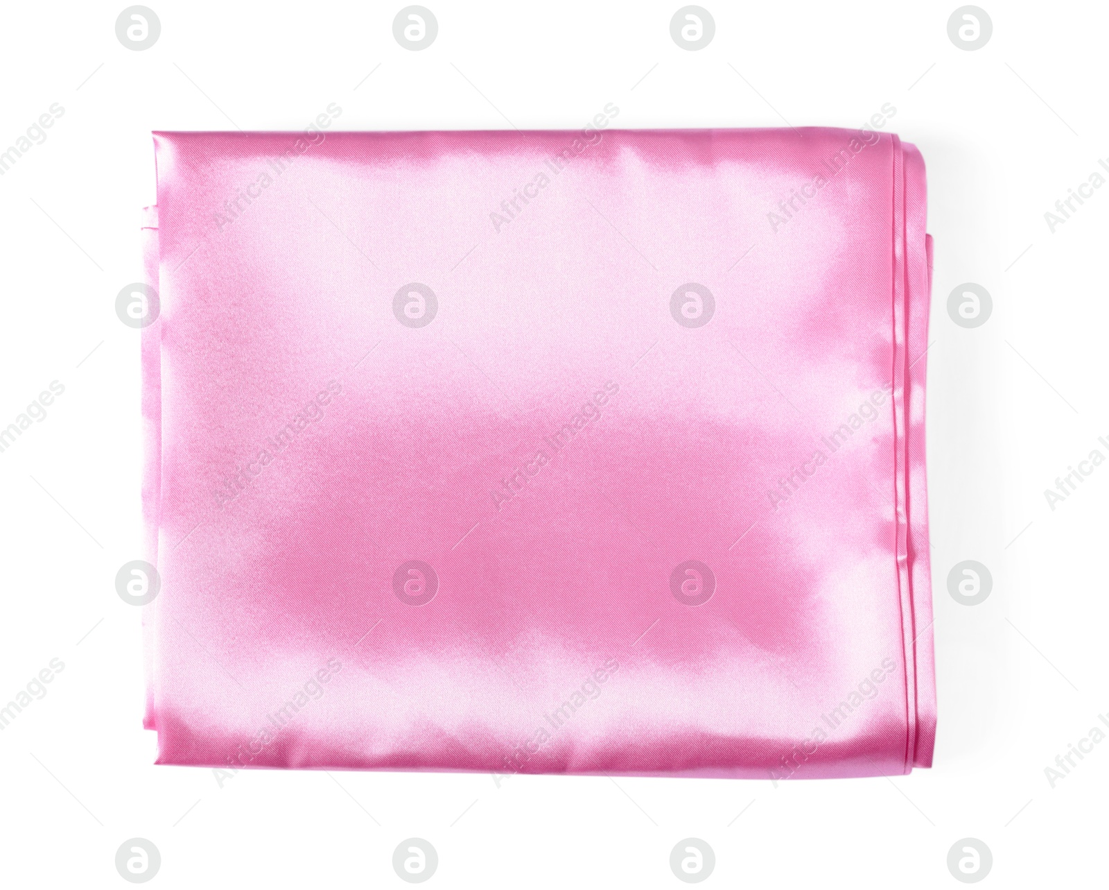 Silky pink bed linens on white background, top view Photo of Silky pink bed linens on white background, top view