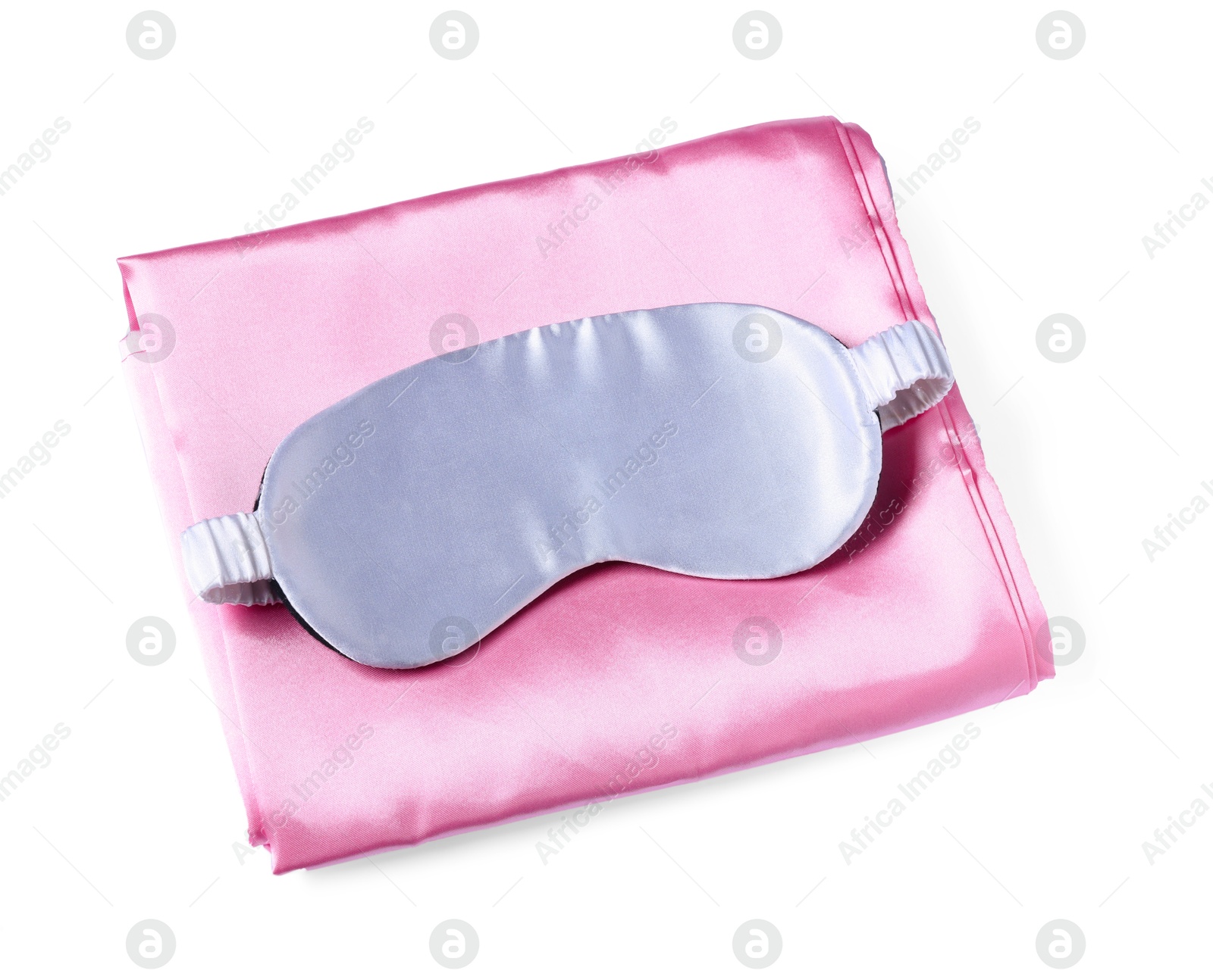 Silky bed linens and sleeping mask on white background, top view Photo of Silky bed linens and sleeping mask on white background, top view