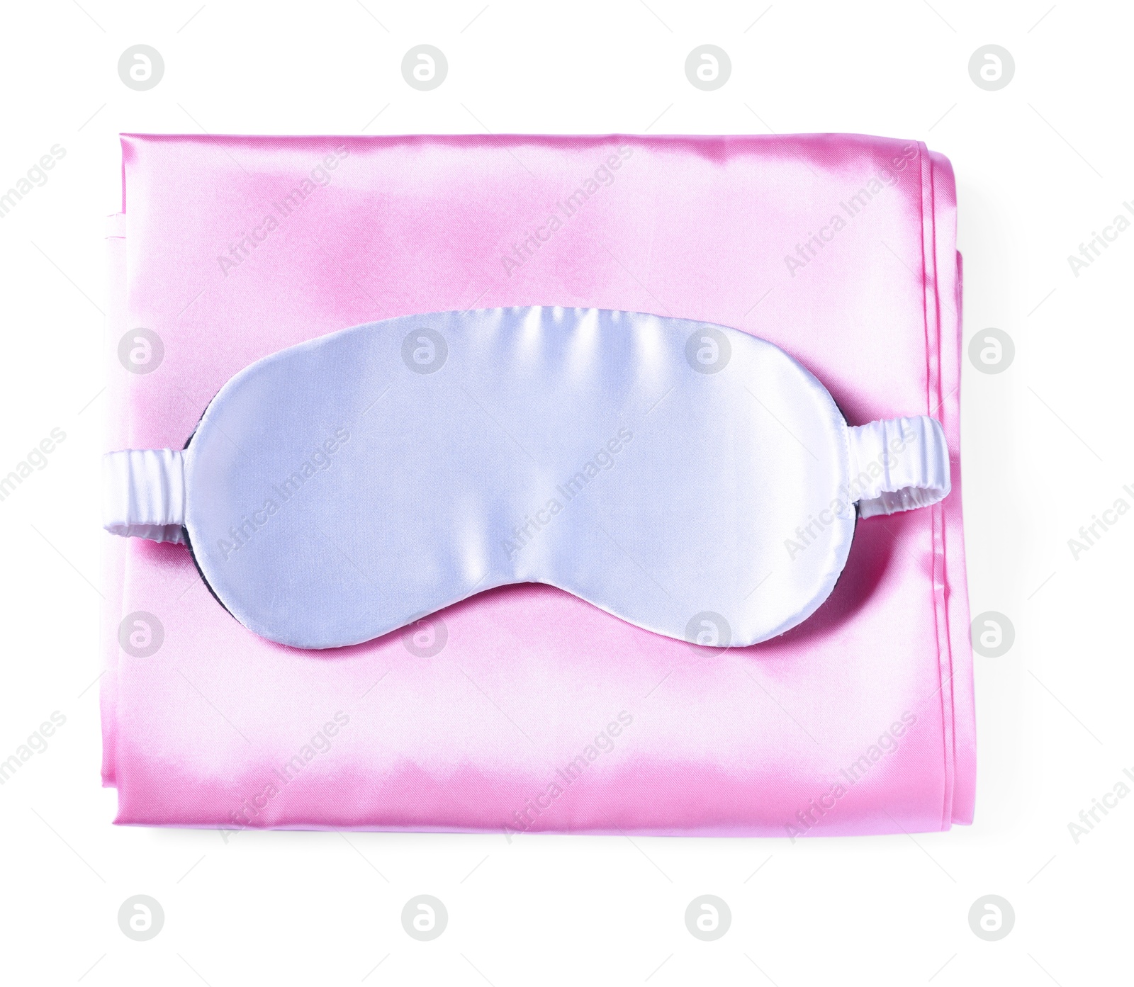 Silky bed linens and sleeping mask on white background, top view Photo of Silky bed linens and sleeping mask on white background, top view
