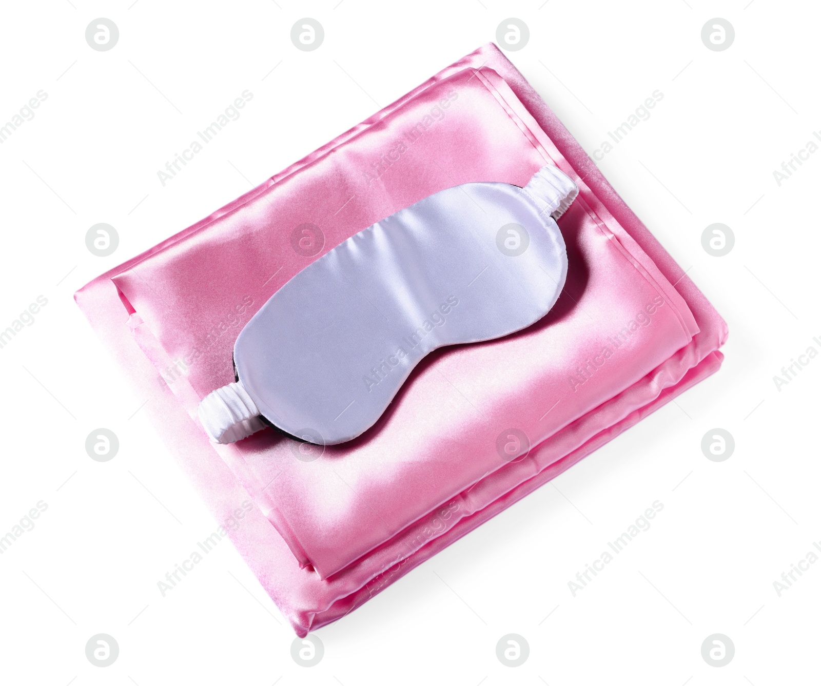 Silky bed linens and sleeping mask on white background, top view Photo of Silky bed linens and sleeping mask on white background, top view