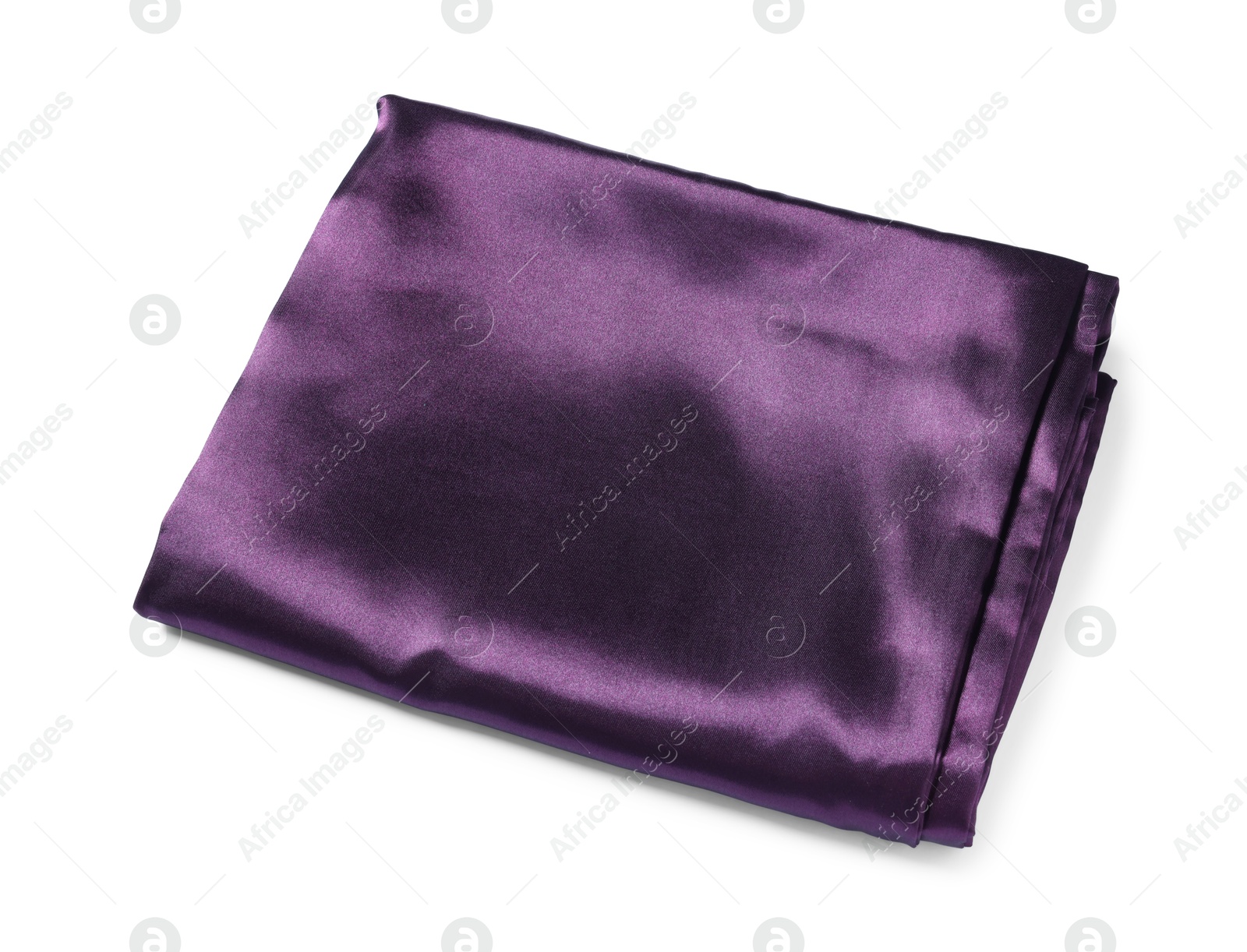 Silky purple bed linens on white background Photo of Silky purple bed linens on white background
