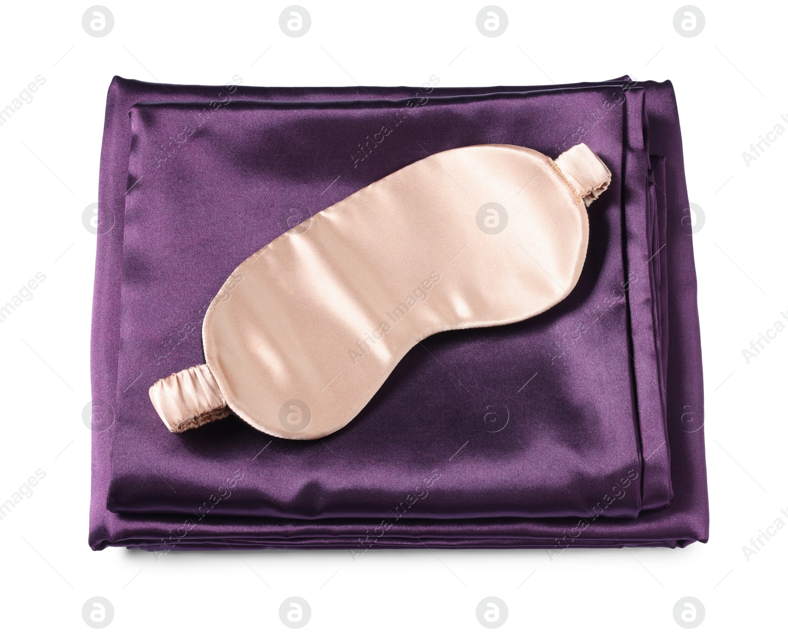Silky bed linens and sleeping mask on white background, top view Photo of Silky bed linens and sleeping mask on white background, top view