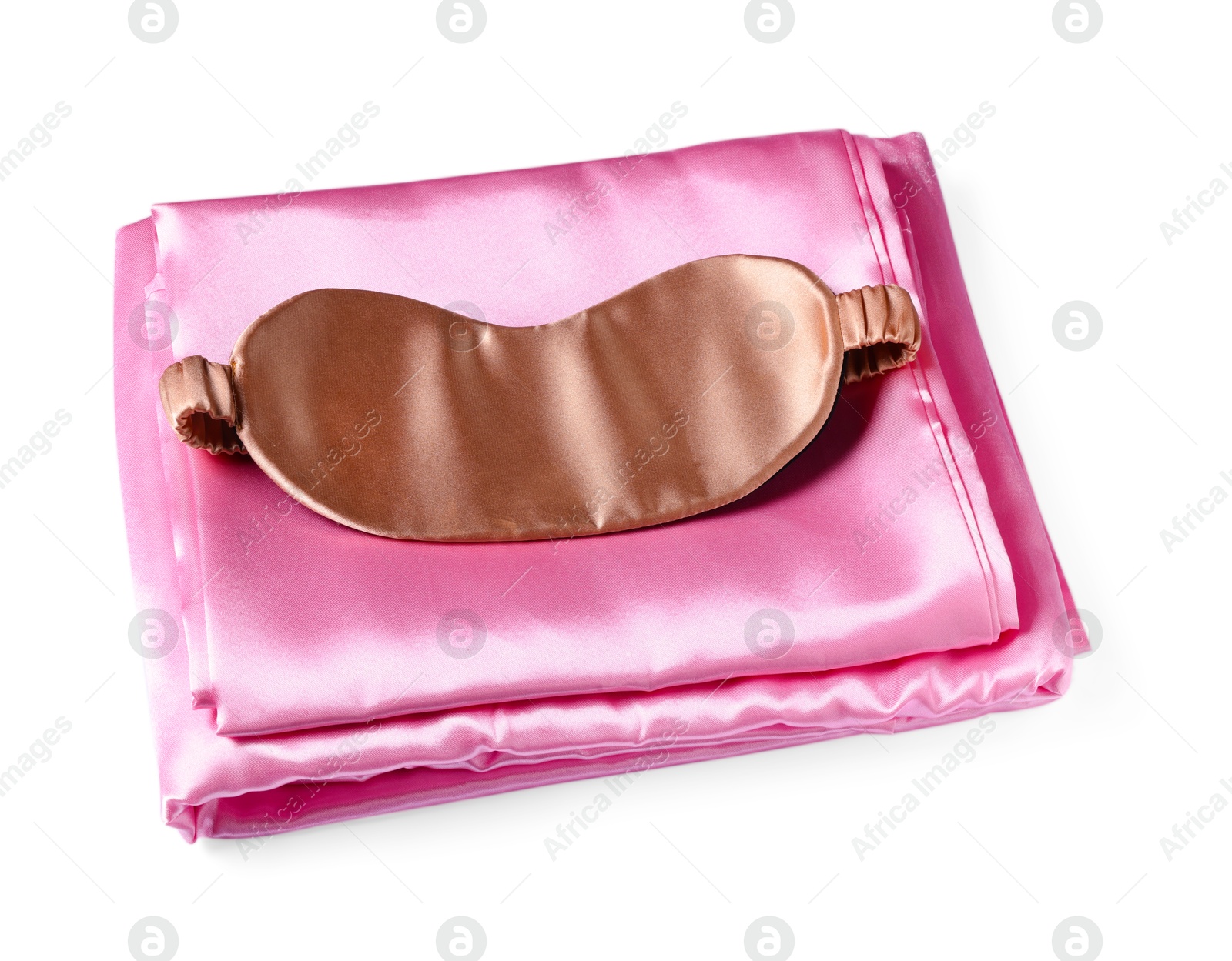 Silky bed linens and sleeping mask on white background Photo of Silky bed linens and sleeping mask on white background