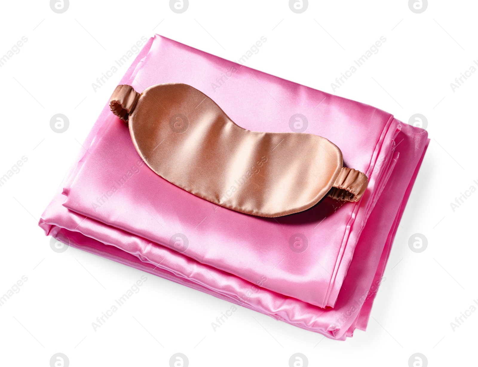 Silky bed linens and sleeping mask on white background Photo of Silky bed linens and sleeping mask on white background