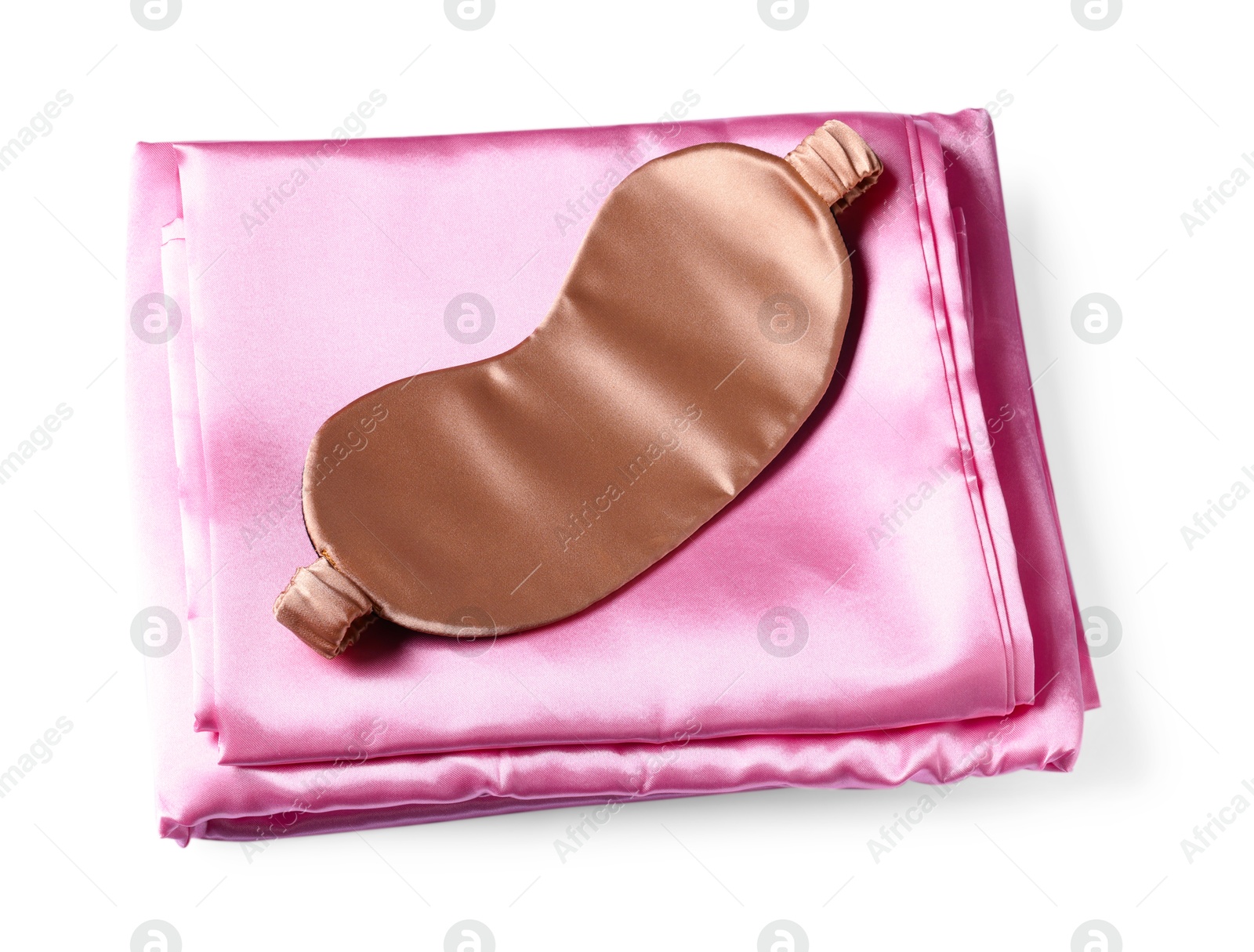 Silky bed linens and sleeping mask on white background, top view Photo of Silky bed linens and sleeping mask on white background, top view
