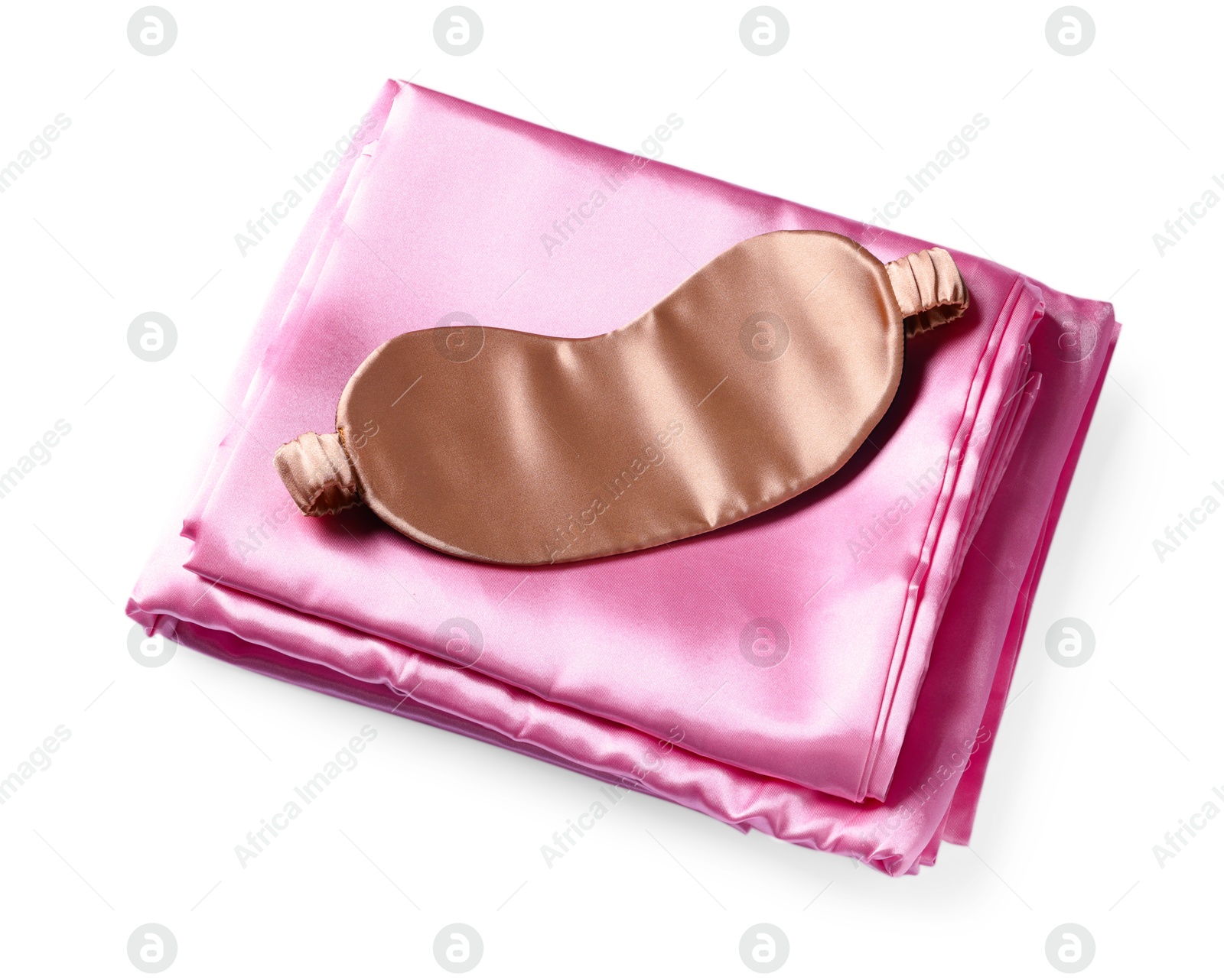 Silky bed linens and sleeping mask on white background Photo of Silky bed linens and sleeping mask on white background