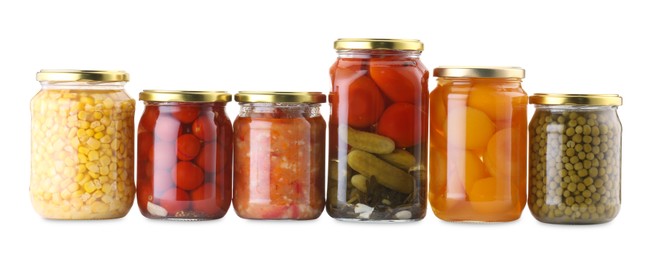 Photo of Many jars with different pickled products isolated on white