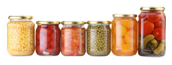 Photo of Many jars with different pickled products isolated on white