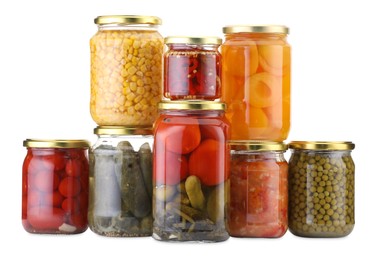 Photo of Many jars with different pickled products isolated on white