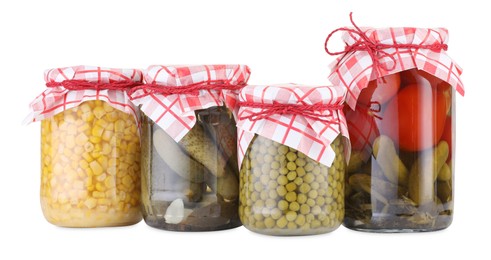 Photo of Many jars with different pickled products isolated on white