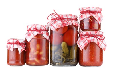 Photo of Many jars with different pickled products isolated on white