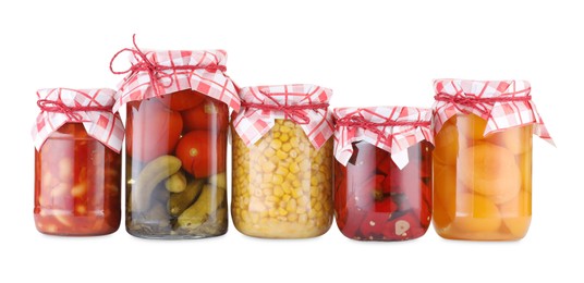 Photo of Many jars with different pickled products isolated on white