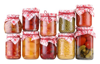 Photo of Many jars with different pickled products isolated on white